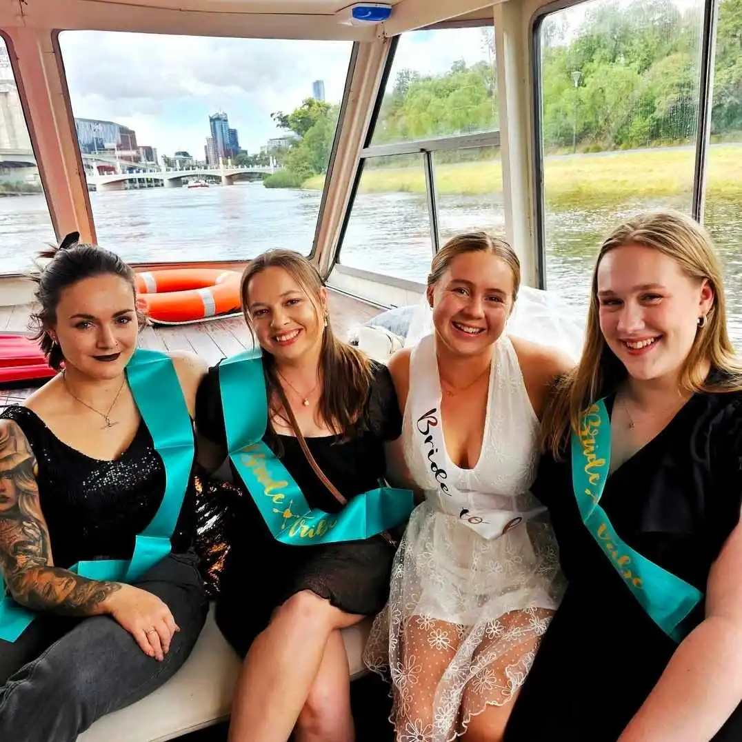 hen party with the bride to be in white