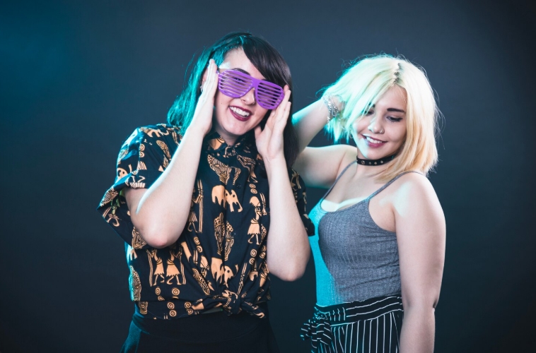 two girls on a drag party dancing