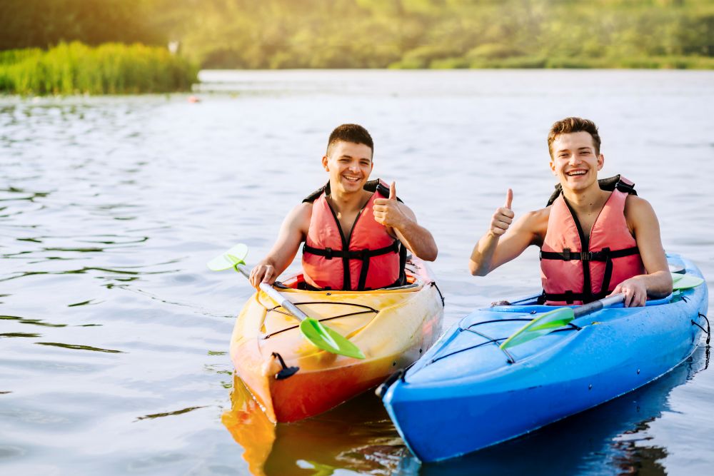 smiling-two-male-kayaker-showing-thumb-up-sign